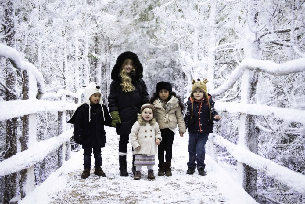 Family enjoying the snow - Best Hotels Near Lapland UK