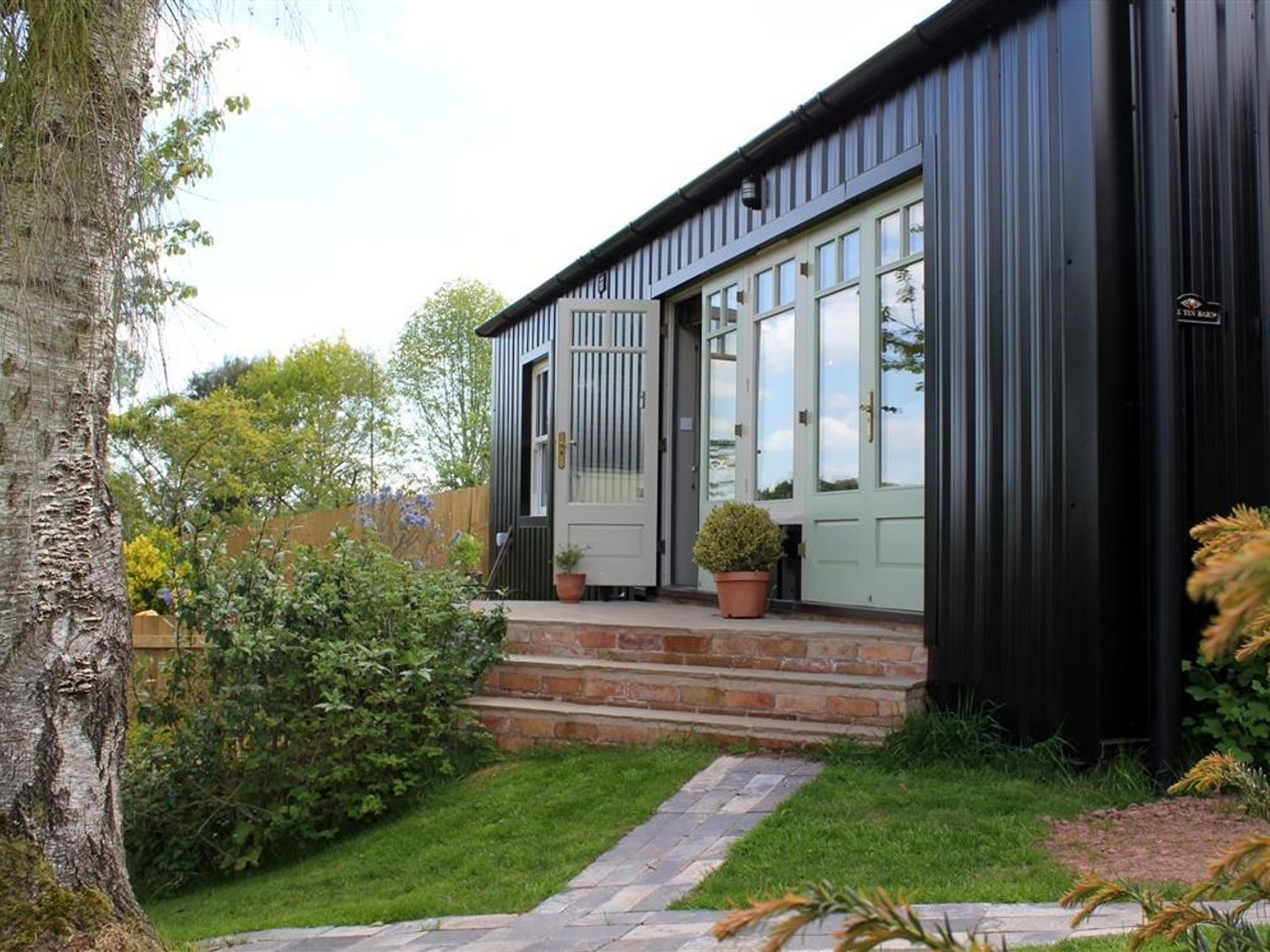 Best Remote Holiday Cottages in UK (Pet-friendly, Isolated, secluded lodges with hot tubs) The Tin Barn