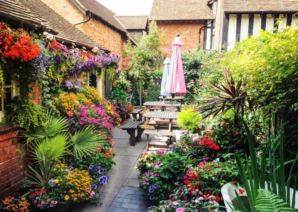 Flowers galore and picnic tables at kid-friendly Bournville Bed and Breakfast mini-garden