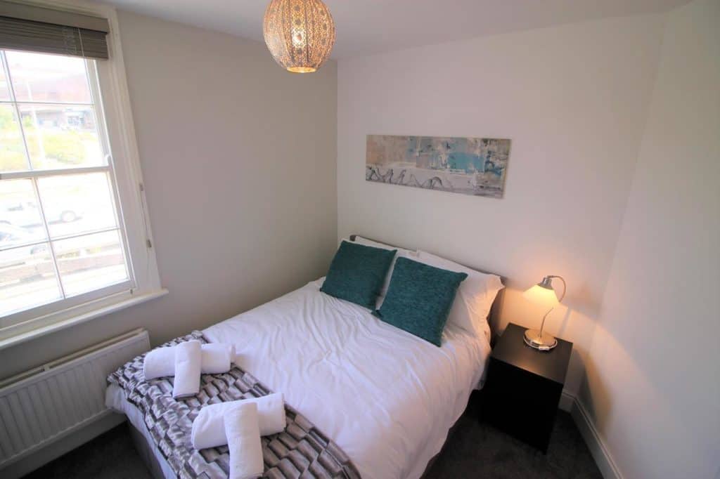 Inside a bedroom of a town house accommodation for large families of 6 at Cromwell,Gorgeous City Centre Town House