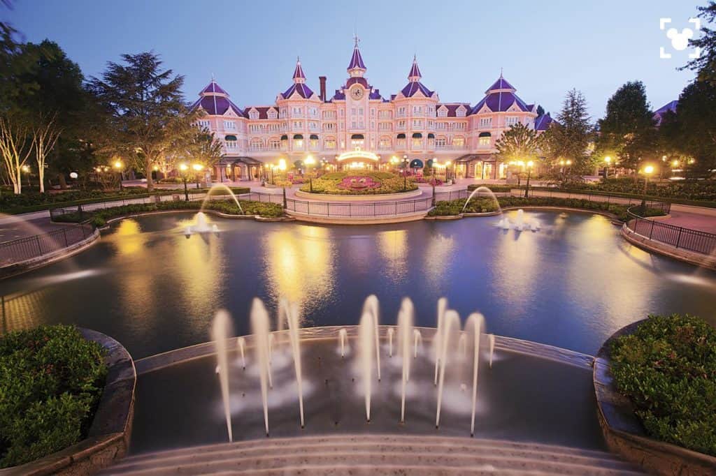 Enchanting fountains & beautiful exterior of kid-friendly Disneyland Hotel found inside DIsneyland Paris