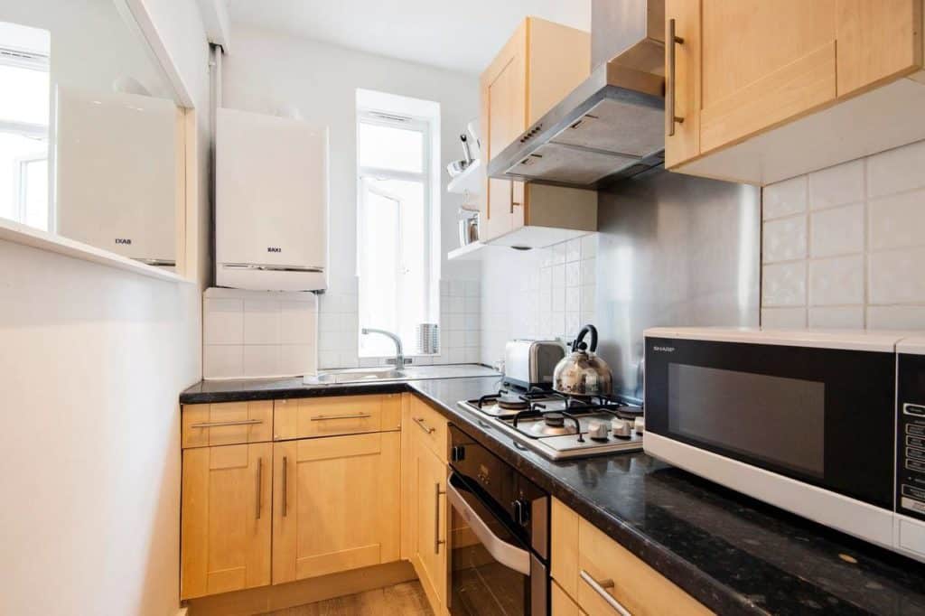 A view of the kitchen of a family apartment that sleeps 6 people at Notting Hill Flat near Portobello Road