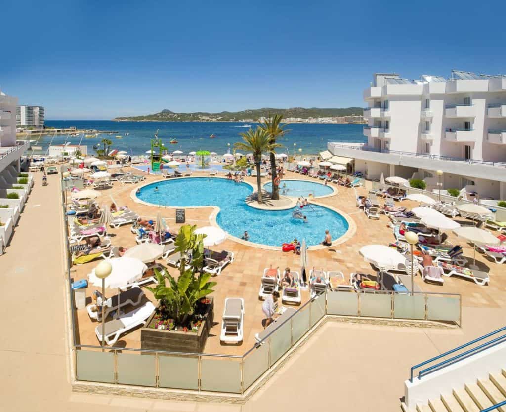 top view swimming pool and ocean at playa bella apartments