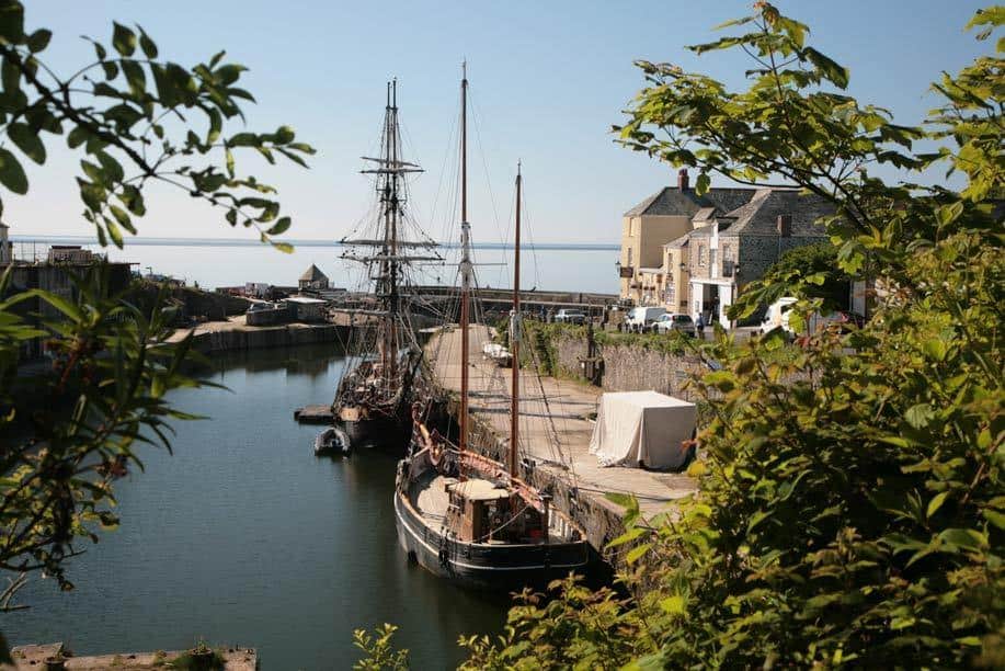 Exterior of Family-friendly Sea Breeze Apartment showing boats on the sea dock.