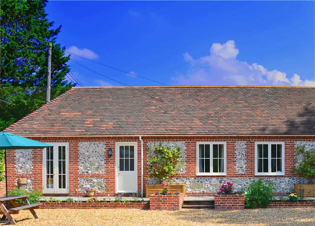 Exterior view of a 3-bedroom family cottage at Stonehenge Cottages