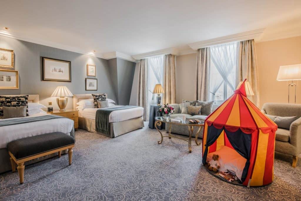 Inside a family room with kid's tent at The Landmark London