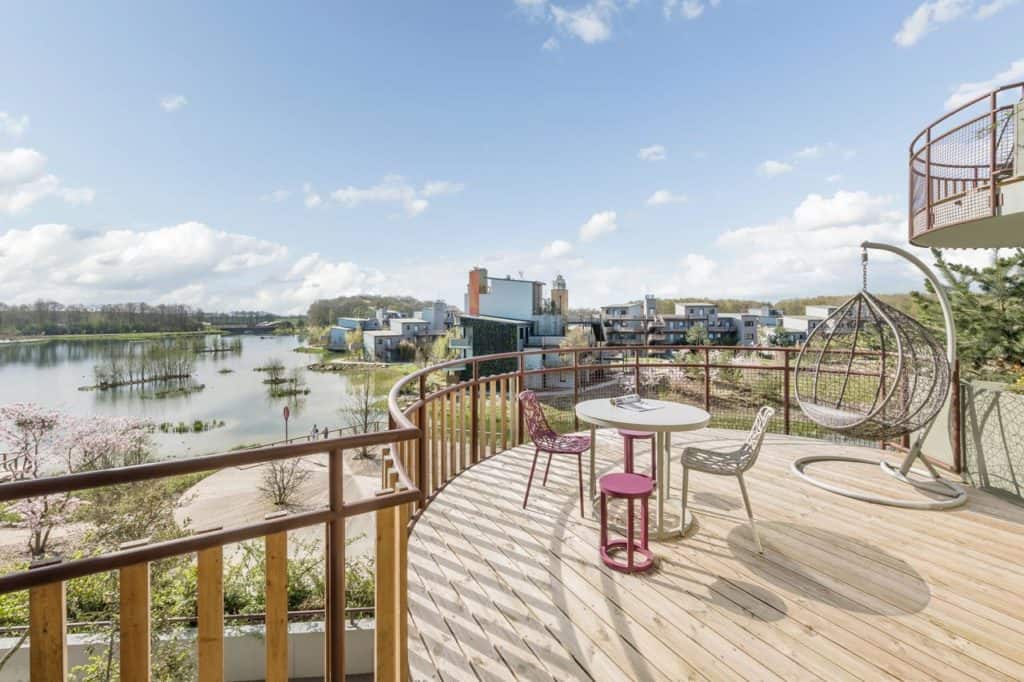 Awesome view with hanging egg chair at family-friendly Les Villages Nature Paris at Disneyland Paris