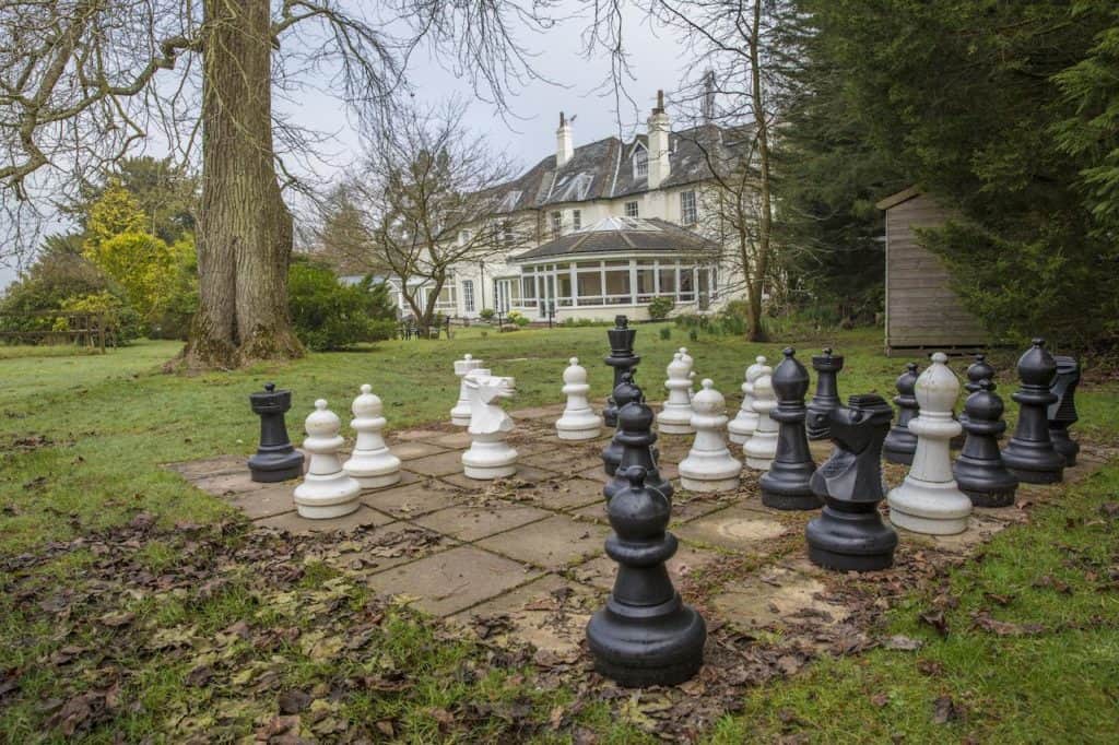 Giant Chess family activity located at Woodlands Lodge Hotel's garden