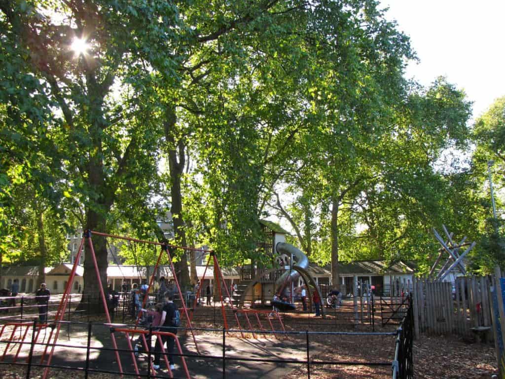 kids playing around the children's playground at coram's fields