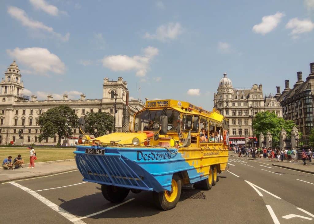 kids riding the yellow amphibious world war II vehicle, london duck tours