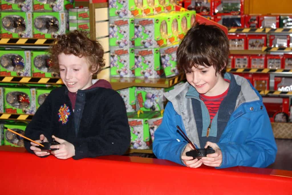 kids trying some toys inside hamleys