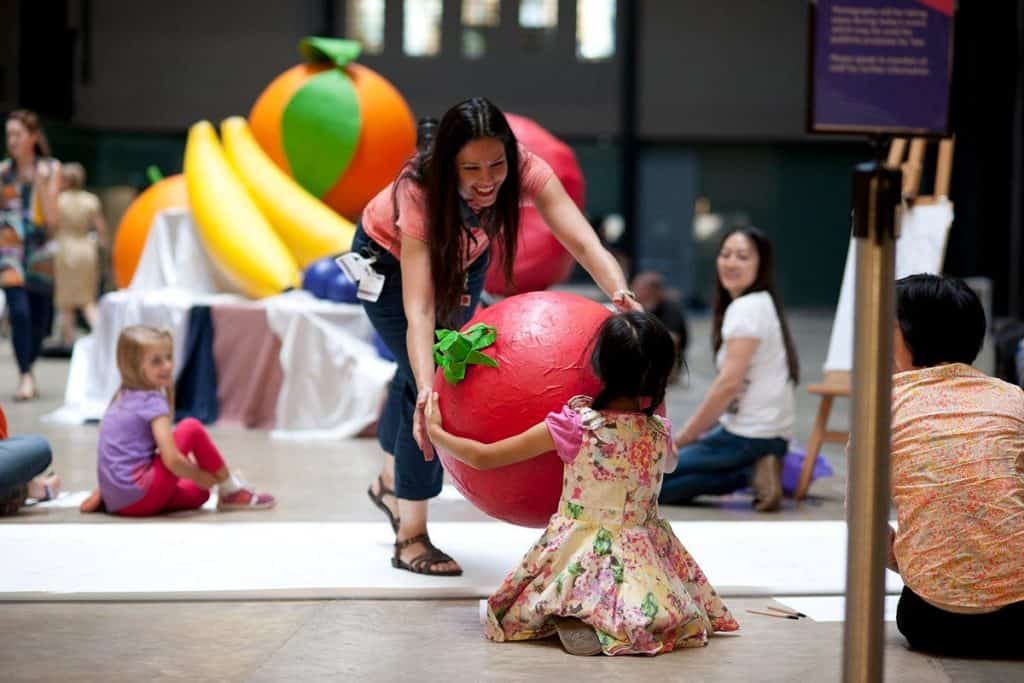 mother and daughter having some artistic fun at the family zone inside the child-friendly tate modern