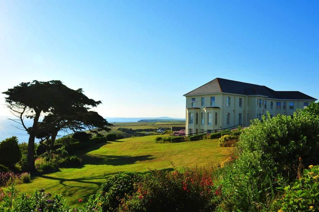 view of the polurrian on the lizard and gardens towards coastal views