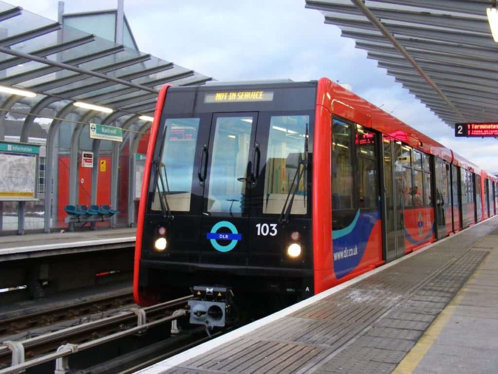 red driverless docklands light railway train in london