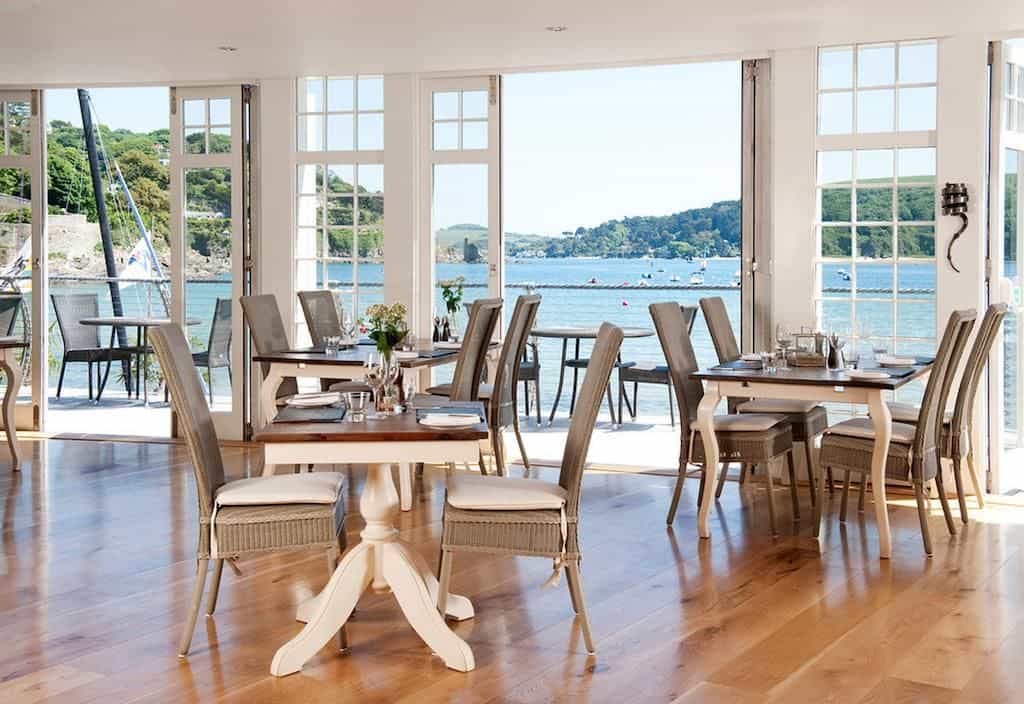 Inside the dining space at South Sands Boutique hotel looking onto waterfront