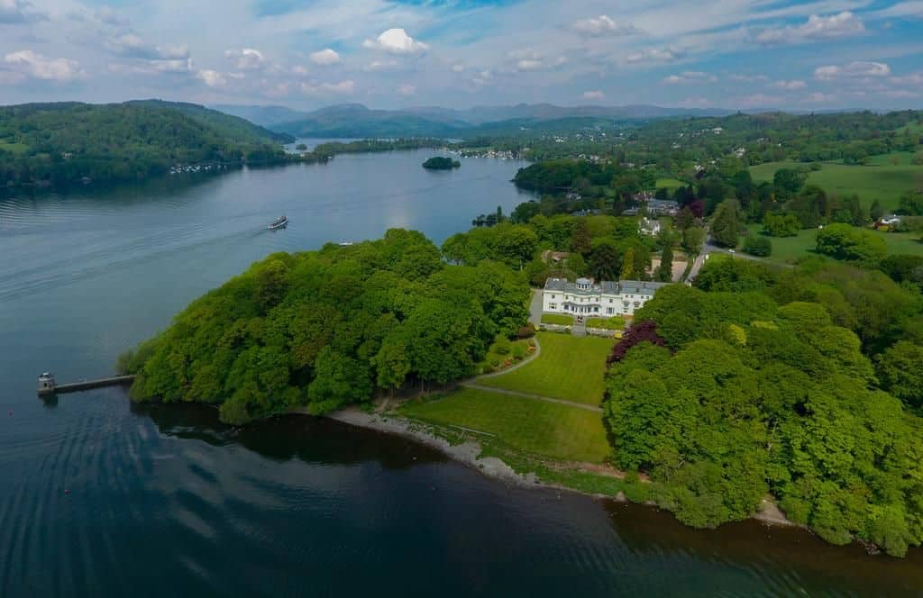 view from above of the storrs hall hotel in bowness on windermere in the lake district