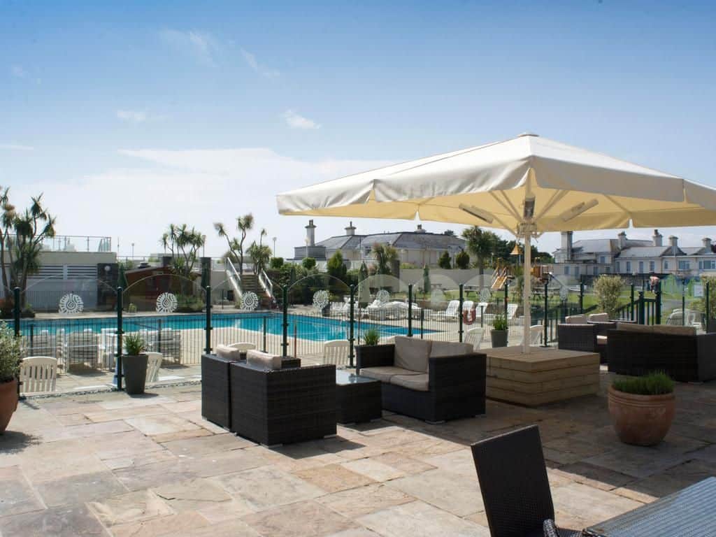 View of the pool and outside area at the TLH Derwent Hotel in Devon