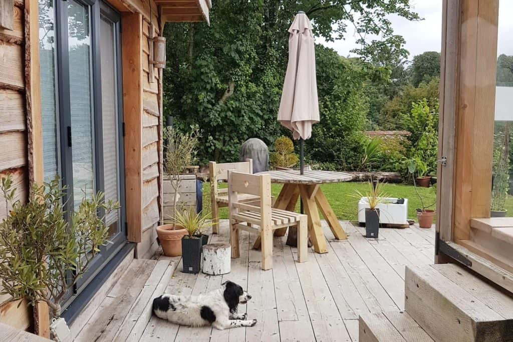 The view from the hot tub steps. Handmade table and chairs & Tia comes too :-)