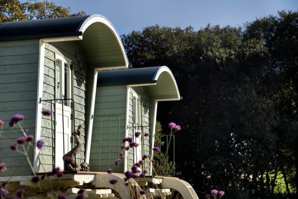 These hand-crafted and bespoke-designed gypsy wagons house the property’s bedroom and bathroom.