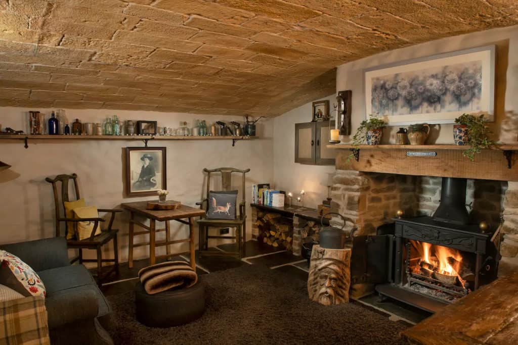 Inside the underground bothy is your kitchen, dining and living area with an indoor passage down to the wagon bedroom and bathroom.