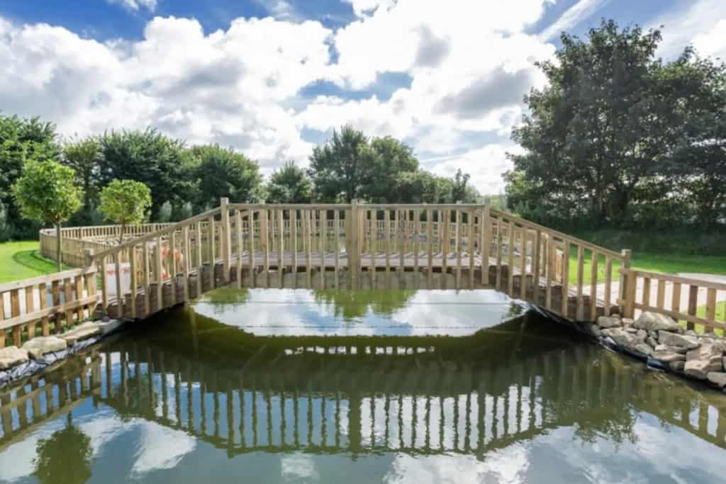 Enjoy feeding the fish from the bridge overlooking our beautiful pond.