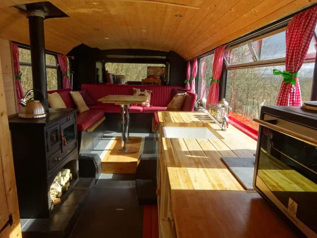 The wood stove warms the dining area.